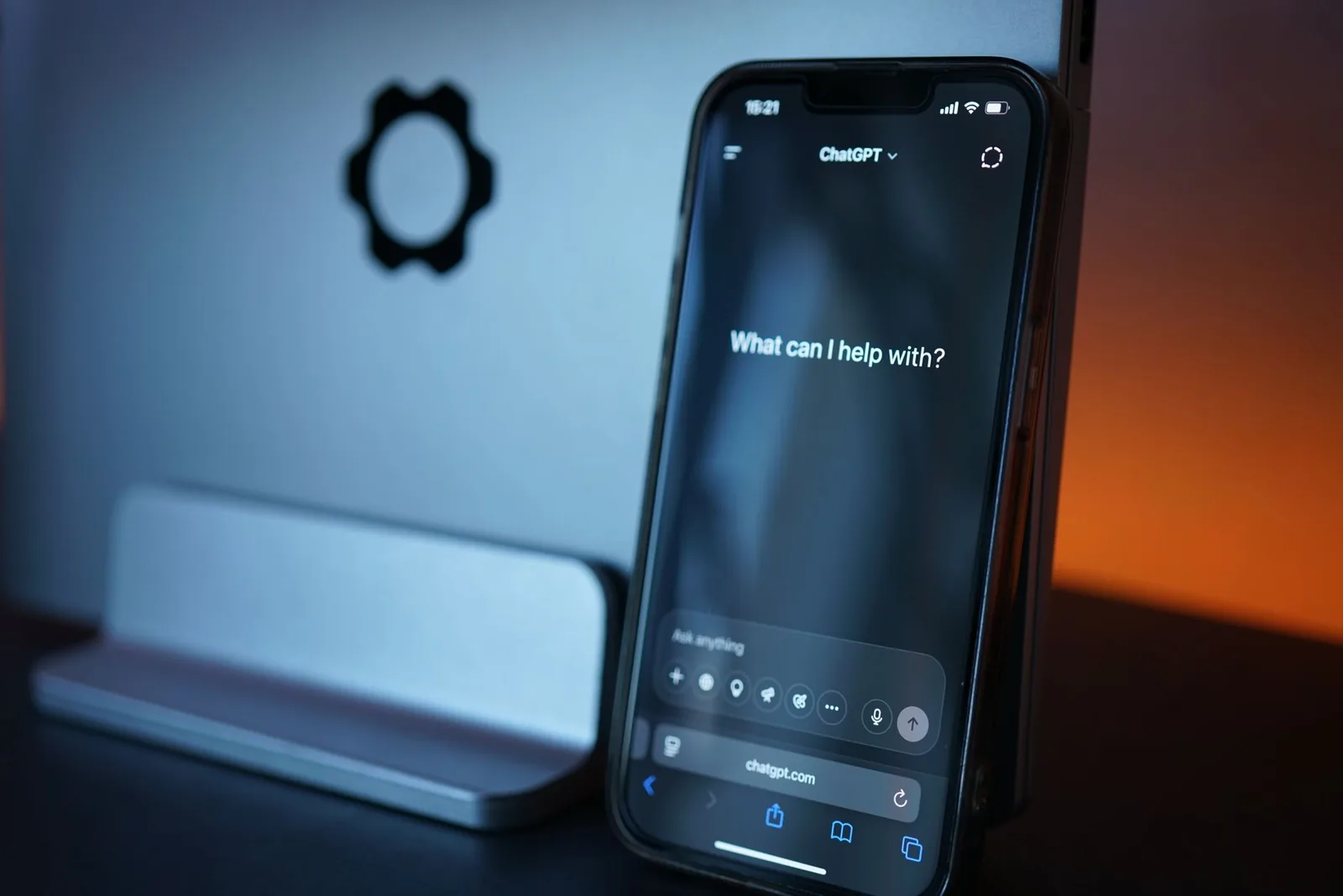 Close-up of a smartphone with AI chat interface, showcasing advanced technology in a sleek design.
