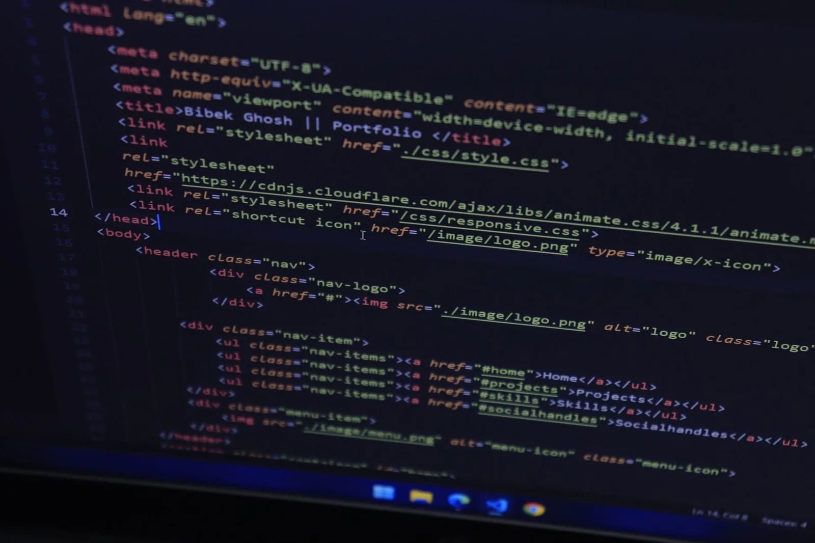 High-resolution close-up of HTML code displayed on a computer screen, perfect for technology themes.