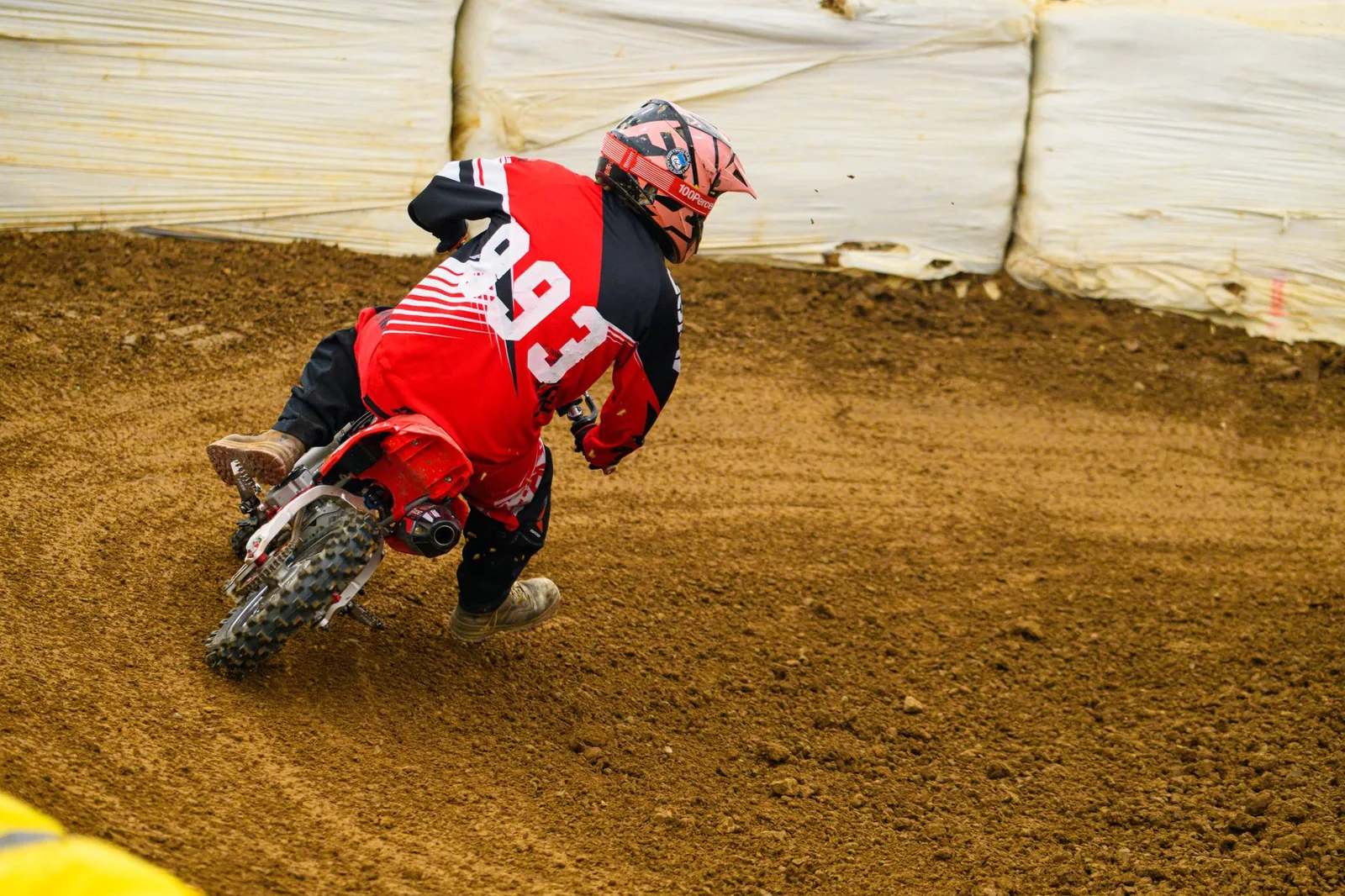 Thrilling off-road motorcycle race captured on dirt track, highlighting speed and agility.