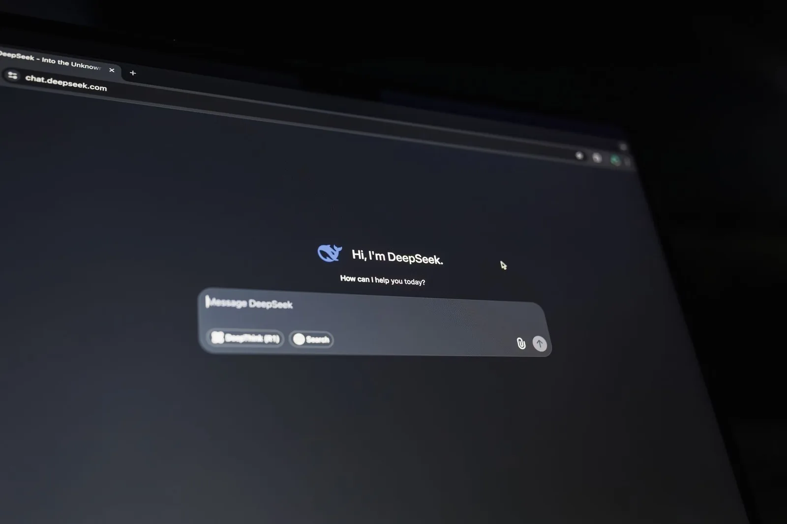 A dark-themed chat interface displaying an AI assistant conversation starter on a screen.